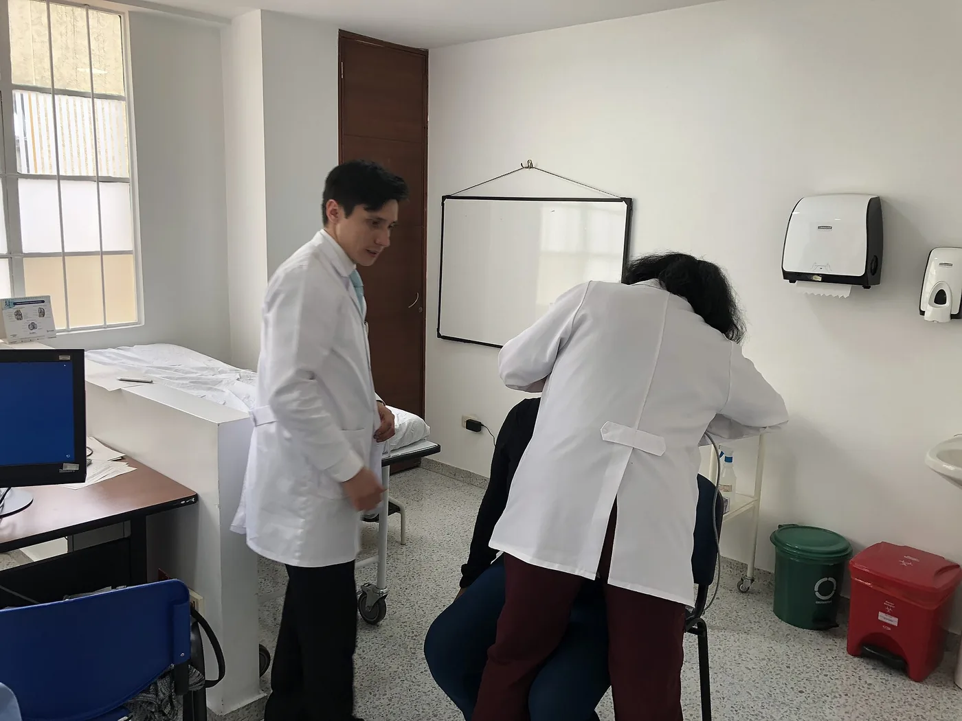 A physiotherapist and patient reviewing a recovery plan together