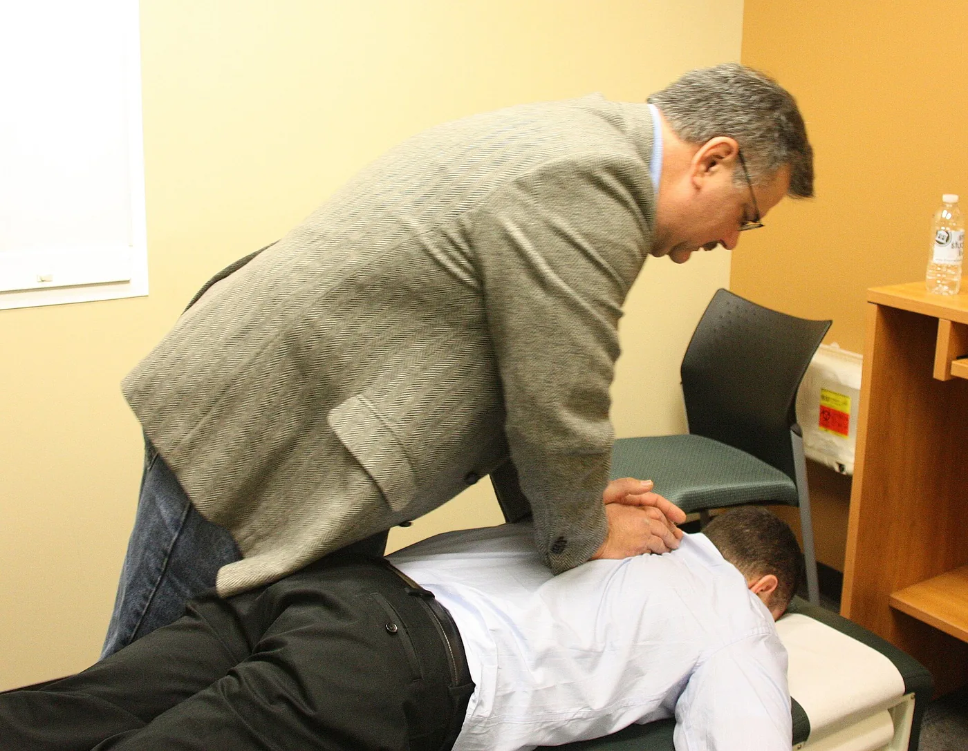 Hands-on physiotherapy treatment in progress
